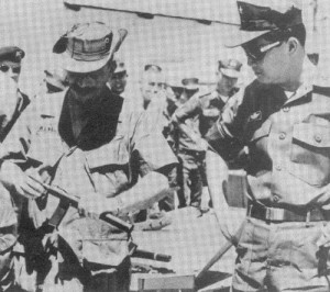 werbell showing silencer to asian military